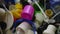 Multicolored plastic garbage in box close-up. Closeup high angle view colorful bottle caps and dispenser pumps on