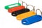 Multicolored plastic trinkets on white background