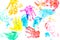 Multicolored prints of children`s hands and feet on white background. Abstract painted background. Children`s art and painting