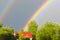 A multicolored rainbow against the sky. Double Rainbow. God`s si