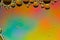 Multicolored, rainbow effect trippy psychedelic abstract in yellow, orange, red and blue