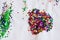Multicolored sequins pasted on a white sheet, children`s creativity