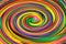 multicolored spiral twisted abstract background. spirally twisted colored stripes