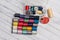 multicolored threads and other sewing accessories on the table needles pins fastener