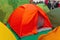 Multicolored tourist tents in the store