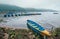 Multicolored traditional rowboats on the morning lake water in Pokhara, Gandaki Pradesh, Nepal. Asian traveling concept image