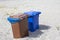 Multicolored trash cans with paper, plastic, glass and organic waste suitable for recycling. Separate waste collection, waste