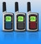 Multicolored walkie-talkies isolated on blue background