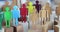 Multicolored wooden figurines of people in crowd of figurines