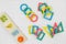 Multicolored wooden toys, blocks on white background. Trendy puzzle toys. Geometric shapes: square, circle, triangle, rectangle.