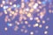 Multicolored yellow, gold, blue circles, bokeh on gradient soft background with pastel tones. Luxury purple pink