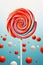 Multicolotred Christmas lollipop close-up over abstract background. Christmas round lollipop vertical background. Creative