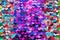 Multicolour Beautiful iridescent sequins texture, fish scale fabric background, close up