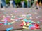 Multicolour paper ticker-tape lies on the ground after celebration of wedding, birthday, carnival, lgbt pride parade or outdoors