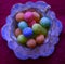 Multicoloured bonbons in an old fashioned teacup.