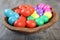 Multicoloured Easter eggs in a beautiful wooden bowl