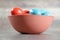 Multicoloured Easter eggs in a clay bowl