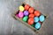 Multicoloured Easter eggs in a wooden box