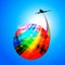 Multicoloured globe with airplane silhouette and rainbow