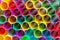Multicoloured plastic drinking straws close up