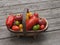 Multicoloured Tomatoes In A Trug