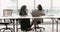 Multicultural businesswomen lead formal talk in conference room
