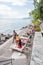 Multicultural community sunbathing on beach along Geneva lakeside and Montreux Riviera promenade in Montreux, Switzerland
