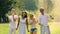 Multicultural group of friends throwing colorful powder over heads at festival