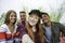 Multicultural guys and girls taking selfie outdoors - Happy friendship concept on young multiethnic people having fun day together