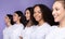 Multicultural Ladies Posing Standing In A Row Over Purple Background