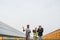 Multicultural people doing inspection on solar farm