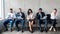 Multiethnic Applicants Waiting For Job Interview Sitting In Row Indoors