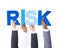 Multiethnic Business People Holding the Word Risk