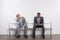 multiethnic businessmen in suits waiting