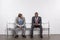 multiethnic businessmen in suits waiting