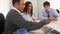 Multiethnic businessmen using tablets in a meeting