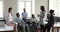 Multiethnic company employees listen speech of African female team leader