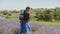 Multiethnic couple kissing in lavender field