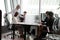 Multiethnic employees work in coworking office workspace