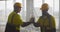 Multiethnic engineer and architect handshake at construction property site