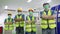 Multiethnic engineer standing arms crossed and wearing surgical mask to prevent covid-19 in manufacturing factory. Concept of race