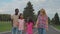 Multiethnic family holding hands walking outdoors