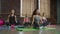 Multiethnic females doing yoga breathing exercise