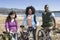 Multiethnic Friends With Mountain Bikes By The Lake