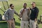 Multiethnic golf players standing on golf course