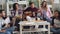 Multiethnic group of friends relaxing singing playing the guitar at home party