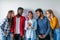 Multiethnic Group of Young People in Casual Wear isolated over grey background
