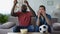 Multiethnic guys watching football match, frustrated by defeat of favourite team