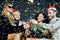 Multiethnic happy friends toasting with champagne celebrating Christmas or New Year, congratulating each other and