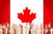 Multiethnic Human Hands with the Flag of Canada